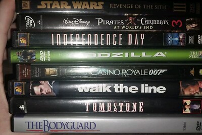 8 Dvds. Used. Tombstone, Walk The Line, Pirates 3, Star Wars 3, Godzilla, 007...-image